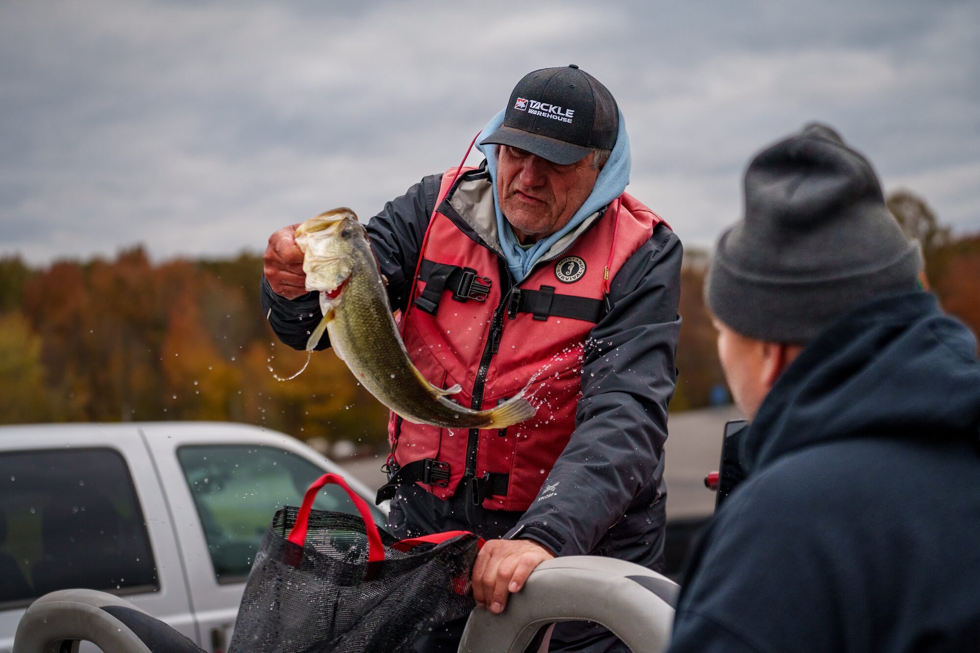 Angler holding up a bass at a USA BASSIN event